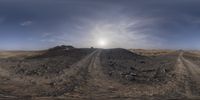 a 3d image of an open desert area with a large mound of dirt, and the sun's flare