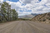 Highland Dirt Road: Winding Through Mountains and Trees