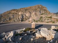 an image of a mountain road by the ocean in the afternoon light taken at dawn