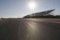 Highway Through the Scenic Landscape: Sunrise and Motion Blur of Cars