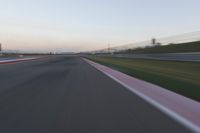 Highway in Motion Blur: Automobiles Against a Clear Sky