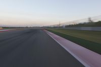 Highway in Motion Blur: Automobiles Against a Clear Sky