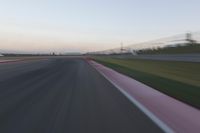 Highway in Motion Blur: Automobiles Against a Clear Sky