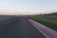 Highway in Motion Blur: Automobiles Against a Clear Sky