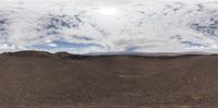 there is a view from the ground at the top of a hill of hills and sand