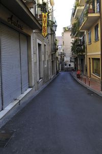 there are buildings that have shutters on each one side and no doors on the other side