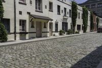 a view of an old cobblestone road in the city of new york, ny