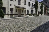 a view of an old cobblestone road in the city of new york, ny