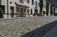 a view of an old cobblestone road in the city of new york, ny