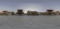 a wide angle photo of the courtyard and buildings in this city center area with buildings