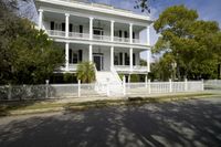 this is an ornately decorated home in the suburbs of savannah, ga with wrought railings