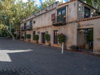 an old building is in a sunny day in a courtyard area of the old city