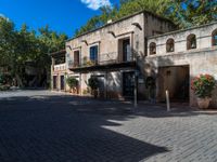 an old building is in a sunny day in a courtyard area of the old city