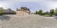 a 360 - view is shown with a man on skateboard and in front of the museum