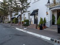 white brick sidewalk near building in town setting with lamp post and street lights on side walk