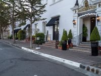 white brick sidewalk near building in town setting with lamp post and street lights on side walk