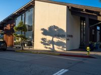 the exterior of a building with trees growing outside it and the name stanini h hudson institute on the front wall