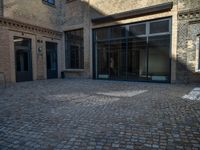 Historic Warehouse in Berlin: Cobblestone Courtyard and Classic Architecture