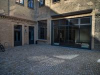 Historic Warehouse in Berlin: Cobblestone Courtyard and Classic Architecture