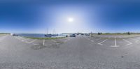 a street with boats parked next to it and the sky as a backdrop is blue