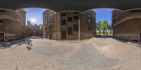 360 view of an outside street from a window that shows the outside view of buildings and trees