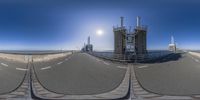 three photos showing different views of a bridge under the sun, and in the middle, a traffic light and a clock tower