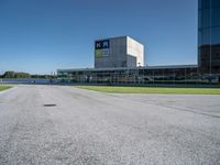 a person on a skateboard is doing a trick in front of a building in an airport