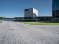 a person on a skateboard is doing a trick in front of a building in an airport