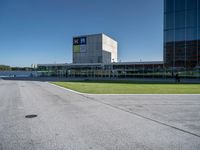 a person on a skateboard is doing a trick in front of a building in an airport