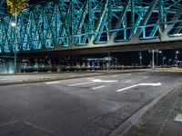 Holland City: A Bridge at Night Overlooking the River