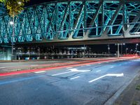 Holland City: A Bridge at Night Overlooking the River