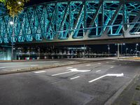 Holland City: A Bridge at Night Overlooking the River