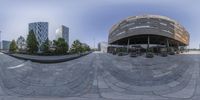 fish eye lens photo of the city and its surroundings in a circular shape with people walking on pavement