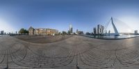 fisheye lens of a panorama view of the city skyline and a bridge from across the street