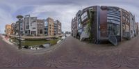 this is a fish eye view of some buildings along a canal in a city street