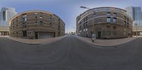 3d panorama of buildings in a city street on two sides of a street on a cloudy day