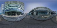 two fisheye photos showing one building and the other, with a car parked in front