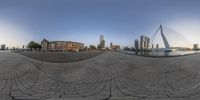 this is an image of a fisheye lens of a city square with skyscrapers