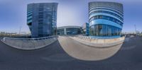 a reflection of the building in the street as seen from the fish eye lens on the front of the photo