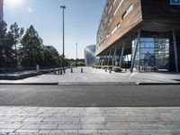 a long walkway going through a museum building next to the street in front of it