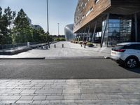 a long walkway going through a museum building next to the street in front of it