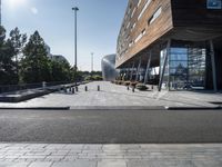 a long walkway going through a museum building next to the street in front of it