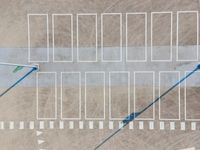 a bird - eye view looking down at the street corner at an empty parking lot