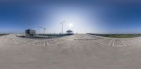 a curved intersection with signs showing direction in a panoramic image made from an upside down fisheye camera