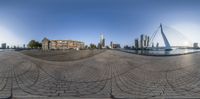 fisheye lens of a panorama view of the city skyline and a bridge from across the street