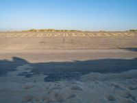 an empty airport runway and road with a message on it in english, saying goodbye