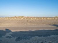 an empty airport runway and road with a message on it in english, saying goodbye