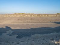 an empty airport runway and road with a message on it in english, saying goodbye