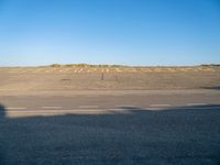 an empty airport runway and road with a message on it in english, saying goodbye