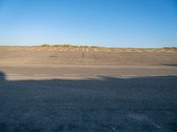 an empty airport runway and road with a message on it in english, saying goodbye